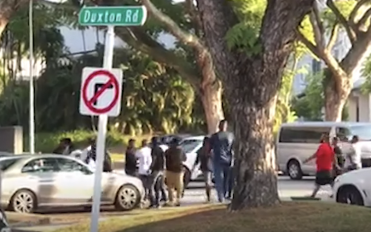 a group of men rioting at Duxton Road on 14 July, 