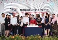 To celebrate the National Silver Academy 3rd ­anniversary, President Halimah Yacob participated in a cake-cutting ceremony along with NSA partners.