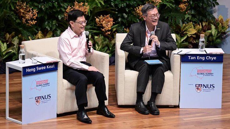 From left: Mr Heng and Prof Tan answering questions from the audience during their dialogue session From left: Mr Heng and Prof Tan answering questions from the audience during their dialogue session