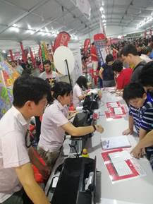 aption: Residents signing up through GEVME at the registration booth at National Day Heartlands Celebrations 2019 @ Central Singapore