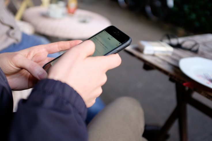 An individual using a phone 