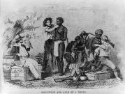 A slave trader inspects a black slave