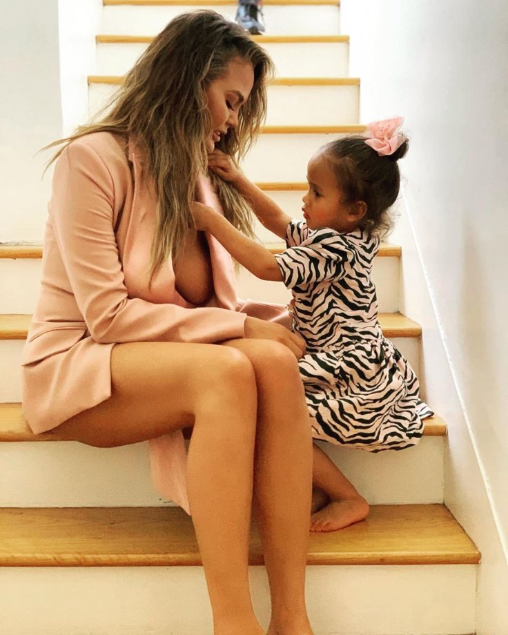 Chrissy Teigen with daughter Luna