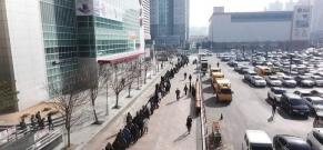 People outside a supermarket in SouthKorea