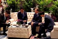 Moon Jae-in with Shinzo Abe Moon Jae-in with Shinzo Abe