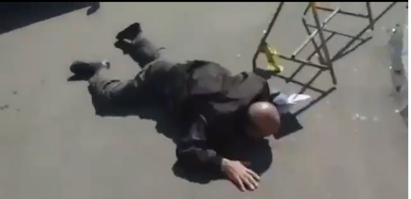 Fallen man outside Iranian hospital