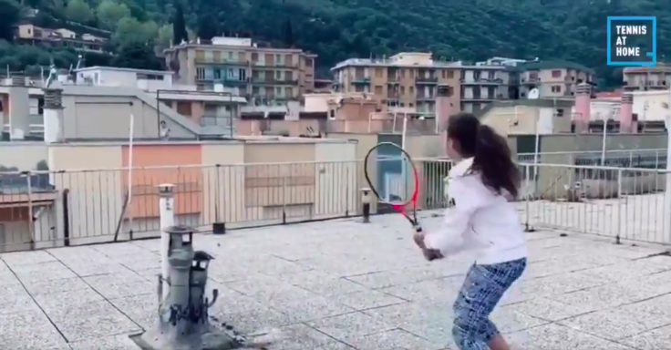 Two Italian girls play rooftop tennis amid Coronavirus lockdown.