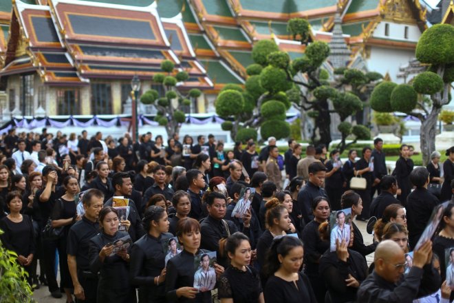 Long live the Thai King: Mourners queue outside Bangkok's Grand Palace to pay tribute