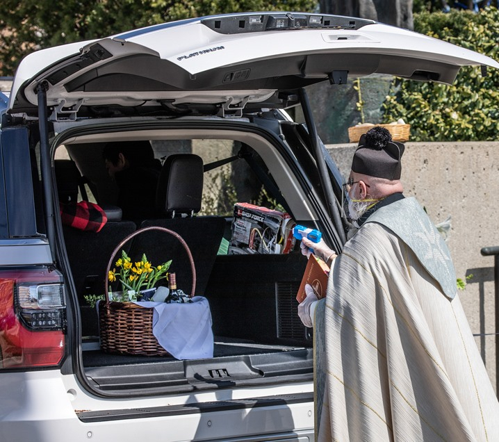 Priest with squirt gun