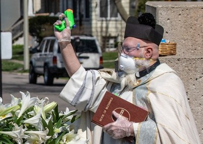 Priest with squirt gun