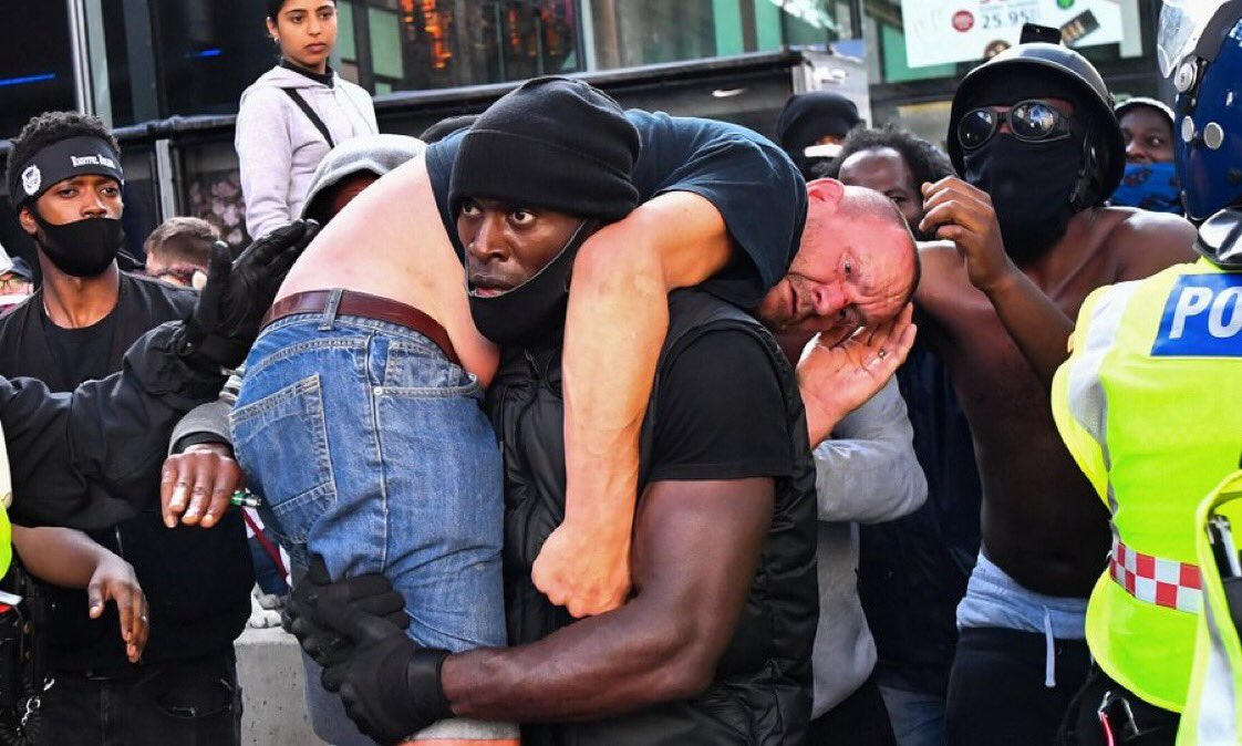 Patrick Hutchinson: Black Man Carries 'Rival' White Protester to Safety