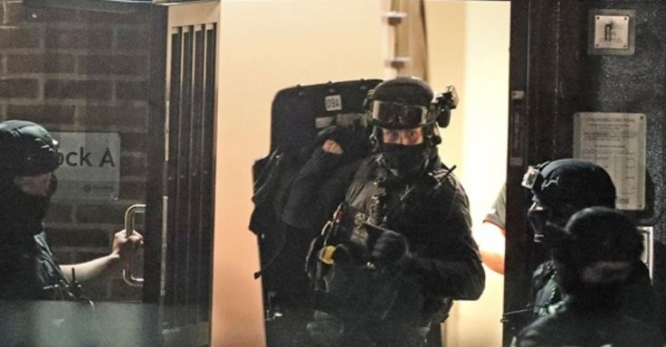 Counter-terrorism police storm a flat
