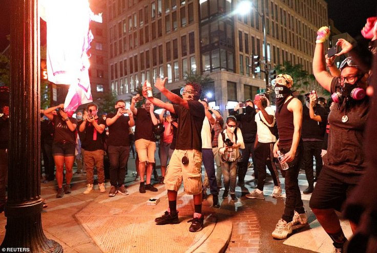 Protesters burning US flag