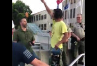 Protester arrested for dangling a donut Protester arrested for dangling a donut