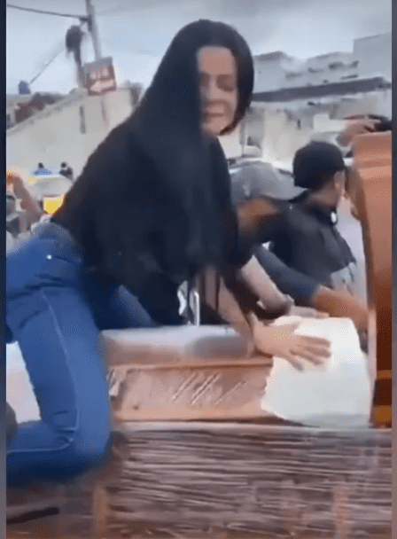 Woman Twerks on Coffin