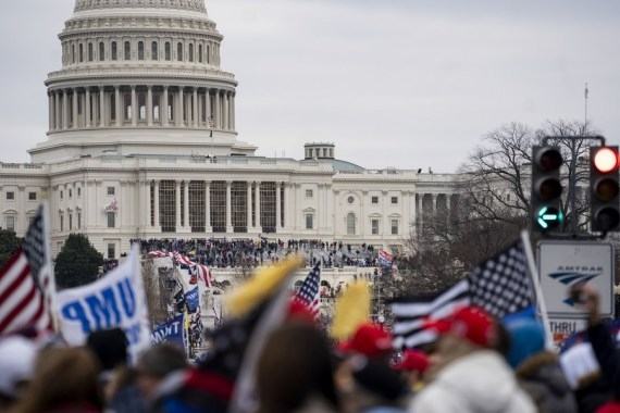 Viral Video Shows Capitol Hill Rioter Smashing Windows To Break In