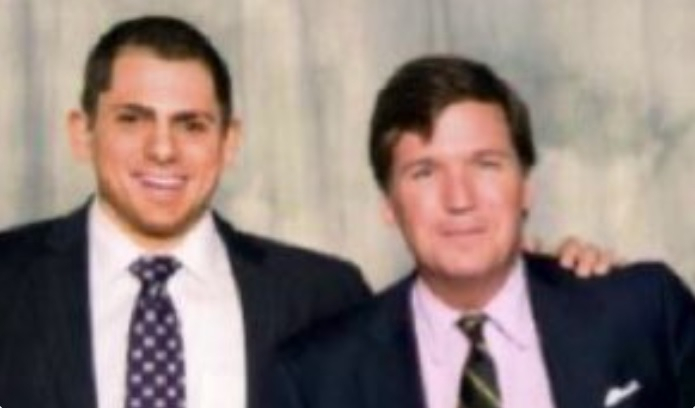 Tucker Carlson pictured with Anton Lazzaro