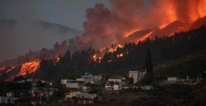 Lava approaching a house on La Palma