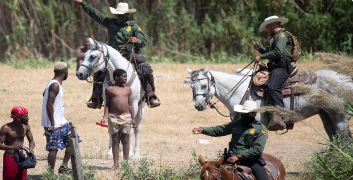 Border Patrol using whips against Haitian refugees