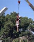 Taliban hangs a body from an industrial crane