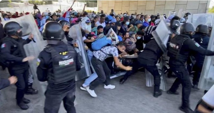 A caravan of migrants has broken through a Mexican police barricade in Tapachula A caravan of migrants has broken through a Mexican police barricade in Tapachula