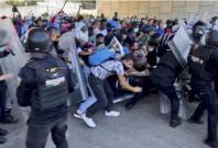 A caravan of migrants has broken through a Mexican police barricade in Tapachula