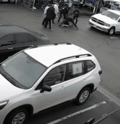 Screen grab of the video showing the anti-vaxxer man attacking health care workers