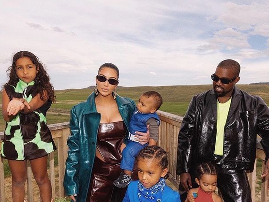 Kim Kardashian and Kanye West with their kids