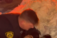  Video showing Adonis Tuggle being pinned on the ground by the unnamed officer 