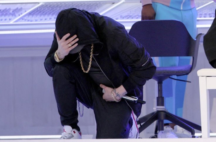 Eminem kneeling
