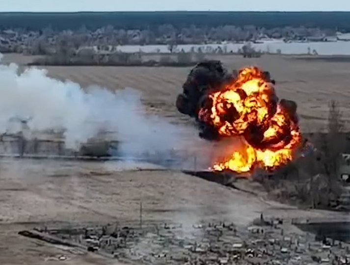 A Russian aircraft bursting into flames after being shot down by Ukrainians near Kyiv