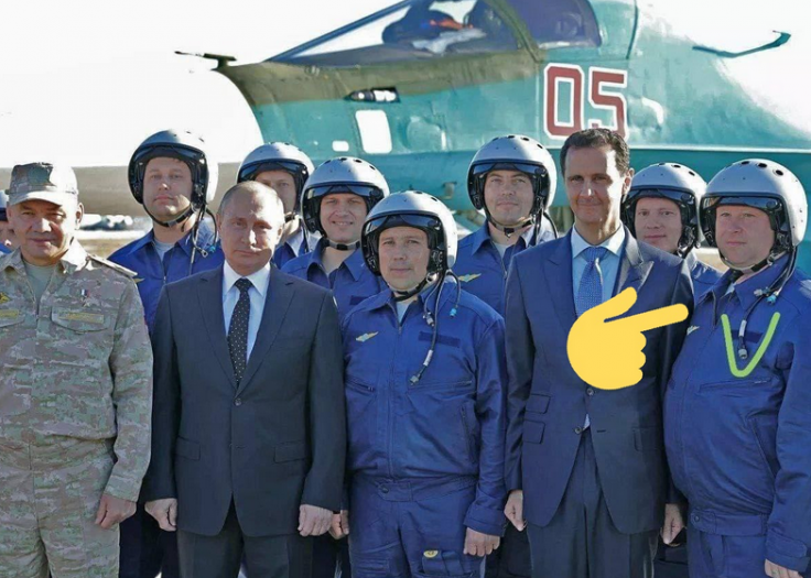 Major Krasnoyarsk pictured alongside Putin and Syrian President Bashar al-Assad from 2016