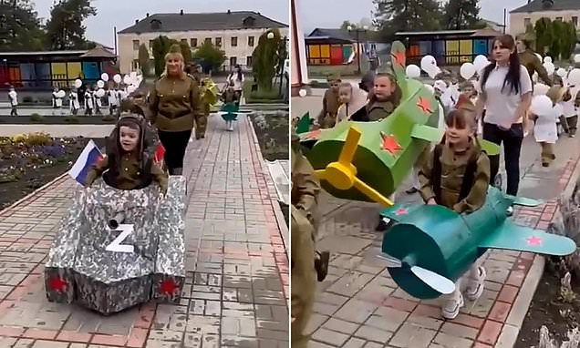 Kindergarten children dress up as tanks, jets