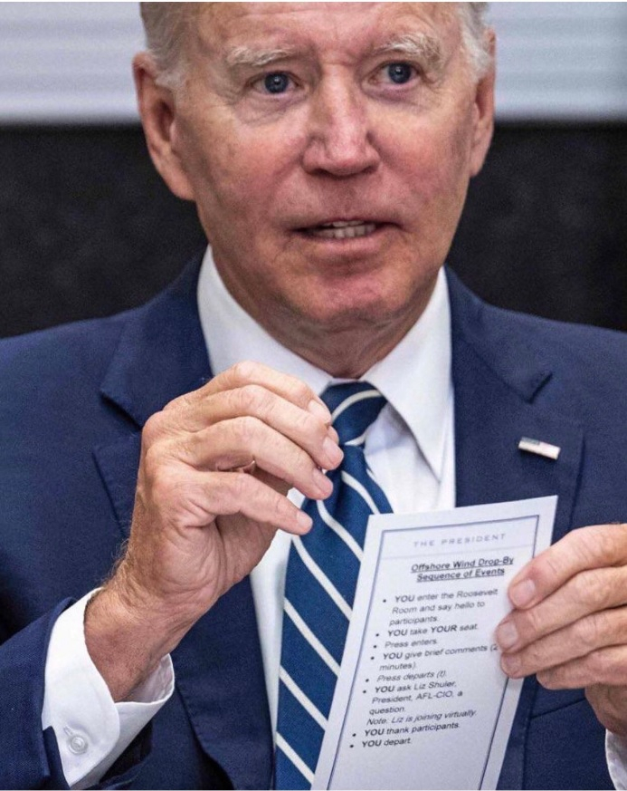 Biden holding cheat sheet