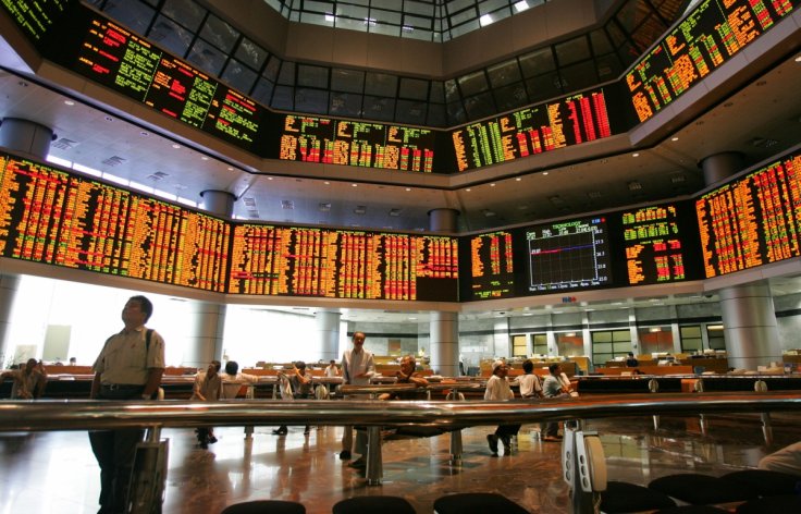 Investors monitor stock market prices in Kuala Lumpur