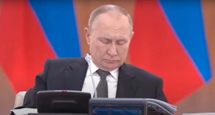Russian President Vladimir Putin is seen sleeping 