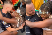 An NYPD cop is seen dirty dancing with female performers An NYPD cop is seen dirty dancing with female performers