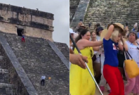 tourist climbs mayan pyramid 