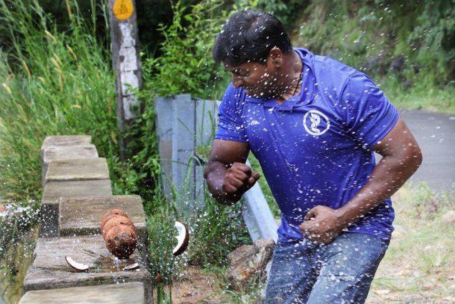 Kerala man crushes record 124 coconuts in a minute with bare hands Kerala man crushes record 124 coconuts in a minute with bare hands