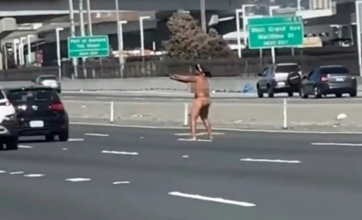 Naked woman firing