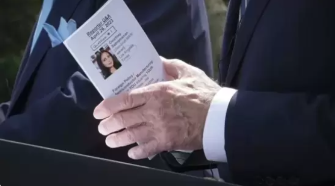Biden holding notecard