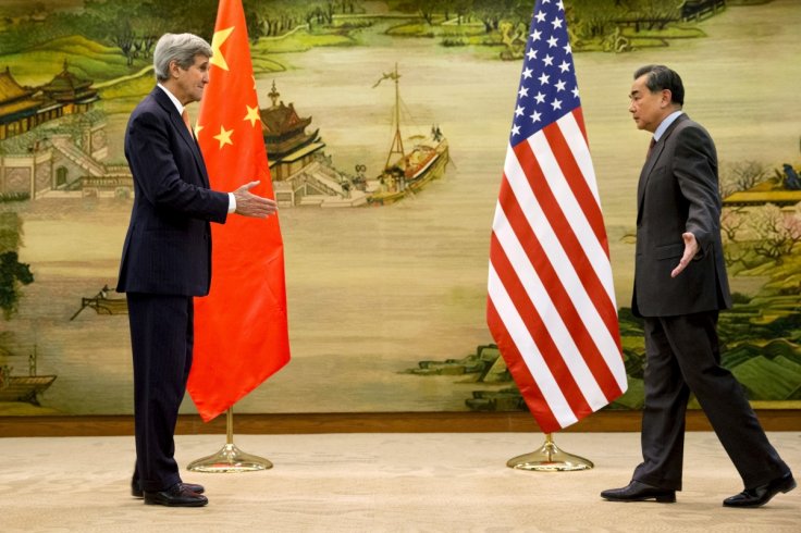 John Kerry in China, says need solution in South China Sea