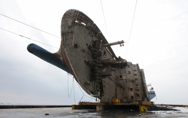 The sunken ferry Sewol sits on a semi-submersible ship during its salvage operations at the sea off Jindo, South Korea, in this handout picture provided by the Ministry of Oceans and Fisheries