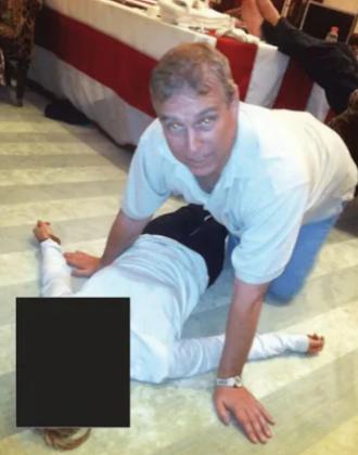 Shocking Photos from DOJ’s Latest Epstein File Dump Show Creepy Andrew Mountbatten-Windsor Crouching Over Woman