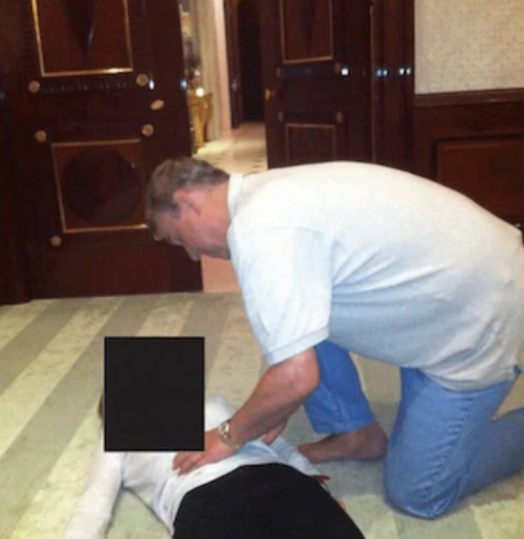 Andrew crouching on woman