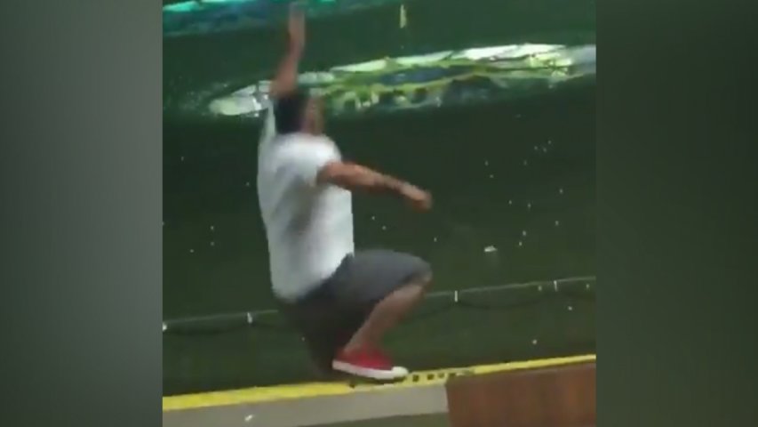 Hilarious video shows golfer miss ball then fall off driving range ledge