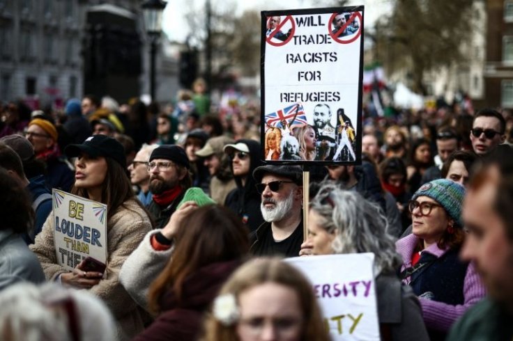 Protesters holding placards