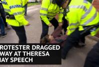 Fox hunting protester dragged along ground by police at Theresa May speech Fox hunting protester dragged along ground by police at Theresa May speech