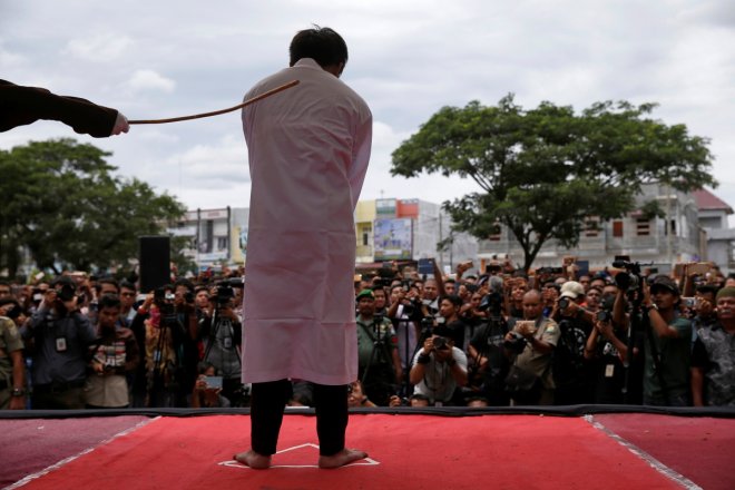 Gay couple in Indonesia caned 83 times in public