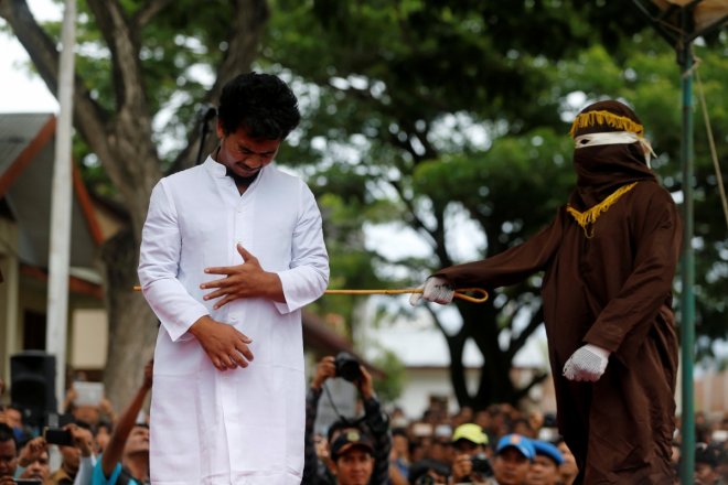 Gay couple in Indonesia caned 83 times in public